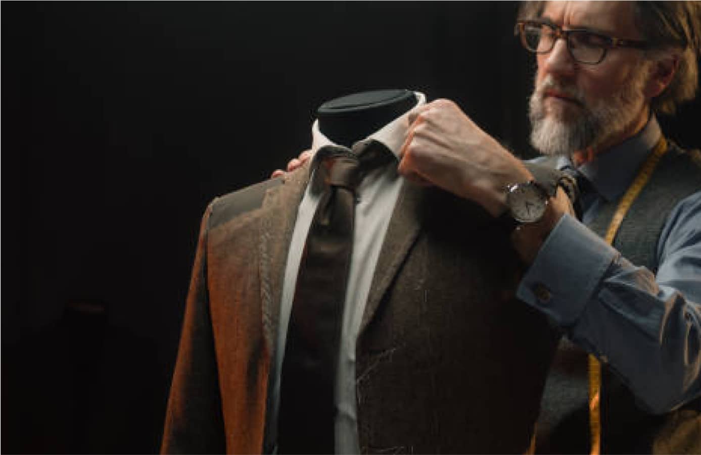 Hands stitching a garment with precision in Deletto Milano atelier